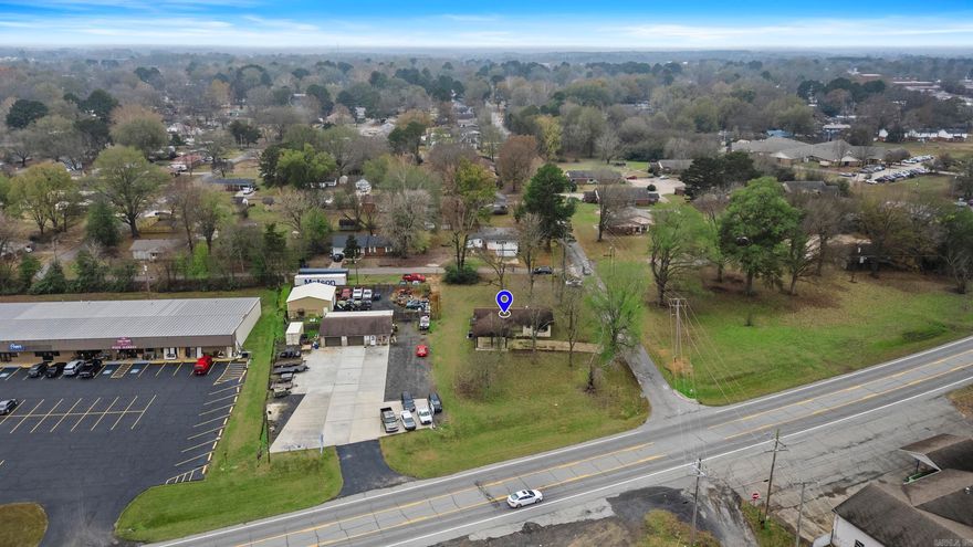 Property is on a generous corner lot in town with one side on Dewitt-Henry Drive, perfect for your C2 business! This home features a practical layout with large common areas, an open kitchen, and room to customize to your style of business. The oversized lot provides plenty of space for more parking with an additional driveway off Lemon. Beebe is growing and so are the clients in the area. Come be a part of the new wave.... Get your new business location today!