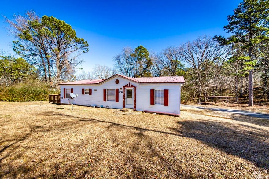 Very clean and well maintained 3bd/2ba home on 1.87 acre with no restrictions, and 5 minutes to Fairfield Bay marina at Greers Ferry Lake. This home is a 1998 double wide mobile home w/ metal roof, circle driveway, a 2 car carport, storage shed, and a 2 bay garage/shop for extra storage. Inside the home features : kitchen w/ a dining nook, nice pantry (fridge and stove convey), large living room w/ fireplace, primary bedroom w/ en suite primary bath (shower & bathtub), extra linen storage, and the 2 guest bedrooms have additional shelving and extra closet space, and the guest bathroom has updated flooring. Fairfield Bay and Greers Ferry Lake are extremely close by and provide swimming pools, tennis courts, golf courses, ATV trails, and much more. Call the listing agent for more information and to schedule a showing. Mineral rights convey. See Agent Remarks.