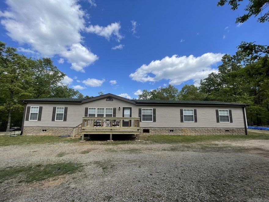 This home is close to town but still fairly secluded on 5 acres! 2007 manufactured home with 2464 sq ft and 4 Bedroom, 2 and a half bath home features large open floor plan, large kitchen with walk in pantry, along with main bedroom on opposite ends from remaining bedrooms, dedicated laundry, 2 separate living areas and multiple decks for outdoor living. Fenced area already in place for your fur babies! Storage shed and circle driveway for ease of parking