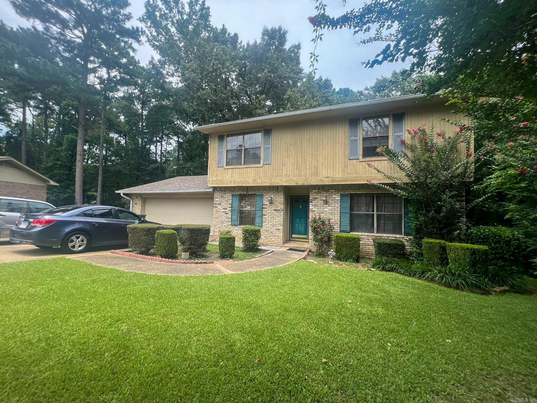 This two-story traditional home offers 4 bedrooms, 2 bathrooms, and 1,988 square feet of living space. The layout includes a spacious living area with a fireplace, a two-car attached garage, and a large back deck—ideal for outdoor gatherings or relaxing evenings. With classic curb appeal and a functional floor plan, this property presents a great opportunity to make it your own.