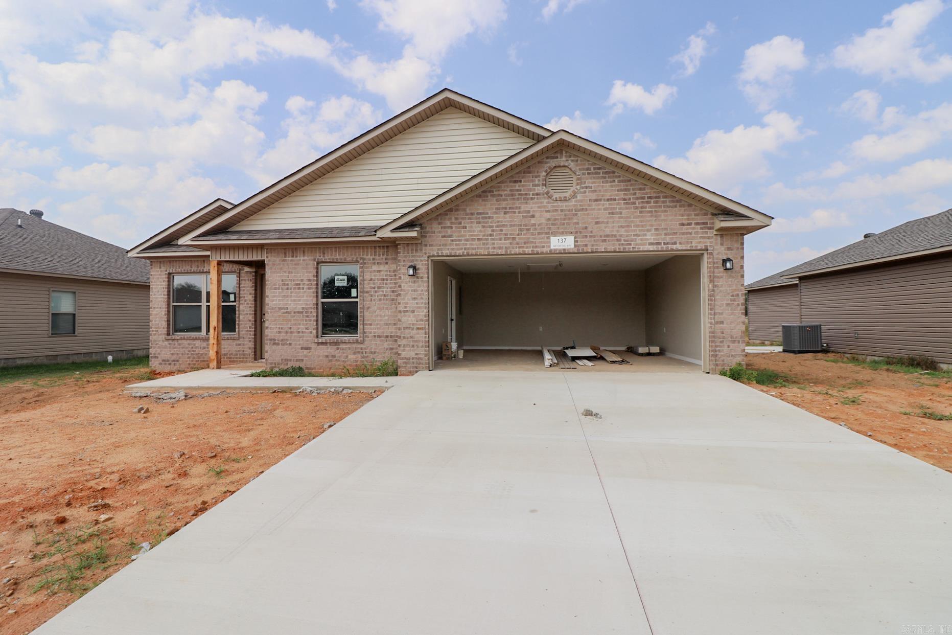 Welcome to 137 Waterfowl Way! Stylish living meets everyday comfort in the sought-after Lakewood Subdivision of Lake City, AR! This 1,256 square foot home showcases bold dark wood shaker cabinets, sleek stainless hardware and fixtures, and striking concrete look countertops, all combining for a look that feels both modern and timeless. Set within the Riverside School District, families here enjoy the unique opportunity for students to graduate high school with an associate degree, A true value that sets this neighborhood and Lake City apart. Beyond the home, you'll love the convenience of being just minutes from Lake City's favorite local amenities: schools, dining, shopping, and more. If you've been searching for a home that blends stylish finishes with family-friendly advantages, 137 Waterfowl Way is ready to welcome you home.