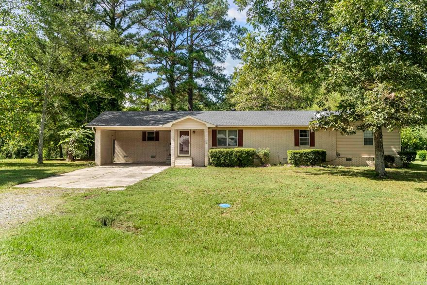 Country living at its finest!  If you are looking for land, water, and a country setting and close to town, then look no further than this amazing property!   This cozy home has plenty of space to explore with 5.73 acres and you’re very own pond.  This would be perfect for a small Hobby farm or family with kids looking to fish and enjoy the outdoors.    A nature lovers paradise, the property backs up to a huge forest yielding an abundance of deer and local wildlife.  This home features your own carport, paved driveway, beautiful brick siding, and a new roof. Your kitchen boasts of custom built real wood cabinets and ceramic stove top oven with overhead microwave.  Bask in the luxury of your personal garden tub and spacious walk-in closet.   There is also a third room that could possibly be used as an office or additional bedroom.  This property has it all with huge potential for even more! Call today and don’t miss out on this great opportunity to move out to your own country escape!