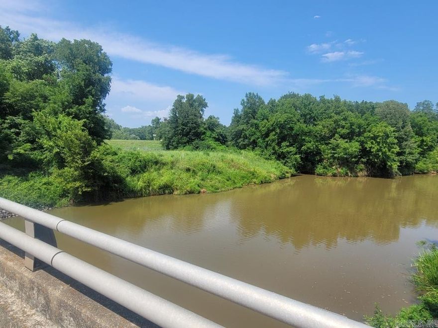 This 4.13 (+/-) acres is partially wooded with waterfront views of Fourche Creek and road frontage on Lindsey Road. It close to the Airport, restaurants and minutes to the highway. Mobile homes are allowed with a permit. Call or text today for more information. Agents see MLS remarks.
