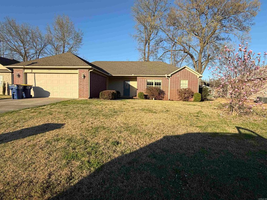 Come take a look at this beautiful, all brick 4 bed, 2 bath home in the heart of Cabot. There is a farmhouse feel to this one with a wood wall in the living room, and tray ceilings in the living room and bedroom. A pantry in the laundry room and two hall closets add extra storage. The outside has a covered porch as well as a large wood deck for entertaining. The garage has a nice work bench area with cabinets for that do-it-yourselfer. New dishwasher, new disposal, newer air conditioner and microwave are also plusses. She is ready for her new owners!