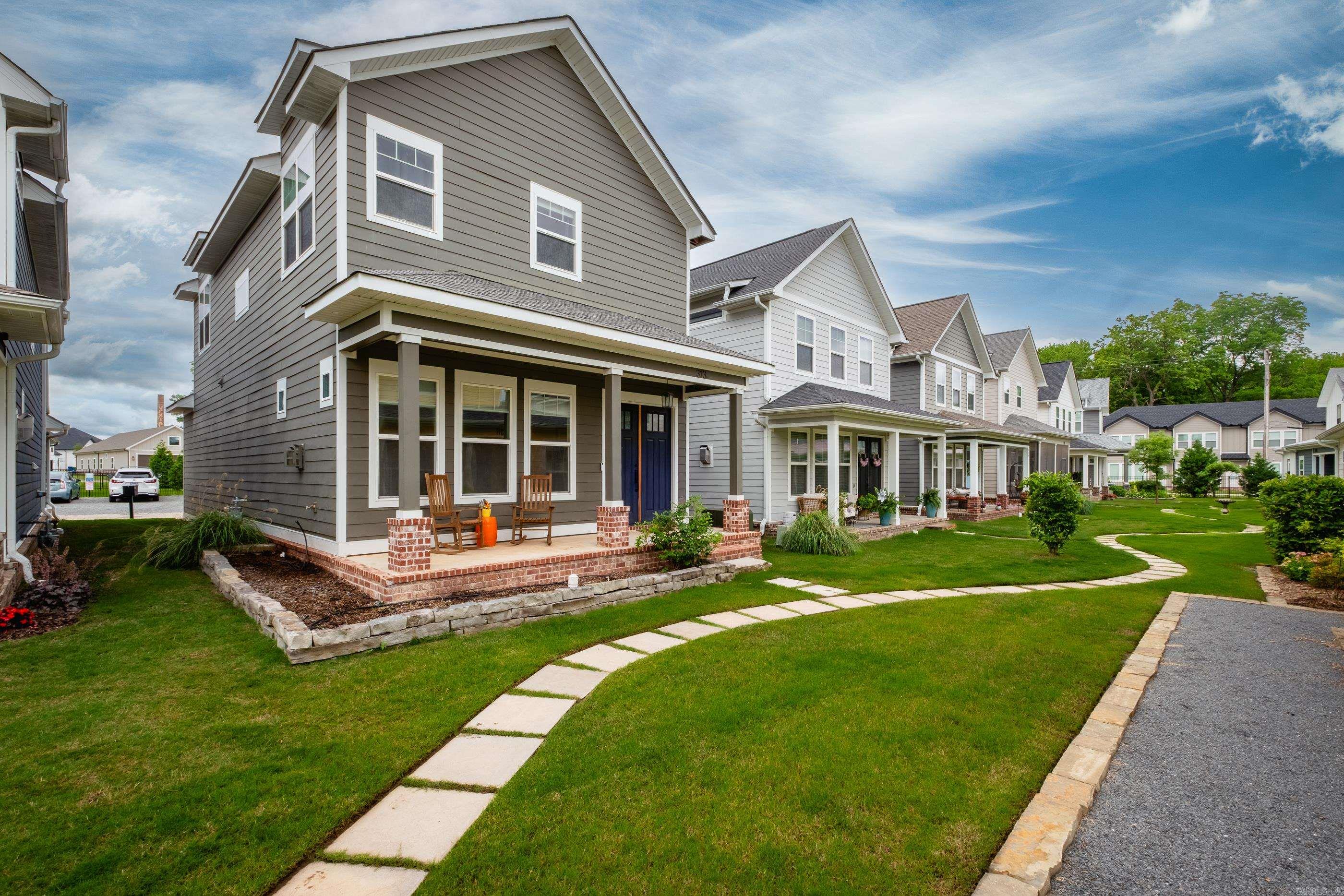 Welcome to life at The Porches of Rockwater, where charm, craftsmanship, & convenience come together in one of Central Arkansas’s most desirable communities. This beautiful home sits just steps from the Arkansas River Trail, offering access to biking & walking paths. Enjoy being moments away from the Argenta Arts District, downtown Little Rock & North Little Rock, with dining, entertainment, & culture right at your fingertips. Inside, you’ll find 10-foot ceilings on the main floor & 9-foot ceilings upstairs, paired with detailed trim work that adds depth & character. The kitchen features a large island & leathered granite countertops, with matching surfaces in the bathrooms. Spacious bedrooms & closets in a functional floor plan complete with powder bath for guests. Step onto the covered front porch & take in views of extended flowerbeds—a peaceful space to unwind. The HOA covers lawn maintenance, fire-pit upkeep, and fencing, giving you more time to enjoy your surroundings & less time worrying about chores. Additional parking behind house. Dog park for your pups! Electric vehicle outlet in garage.
