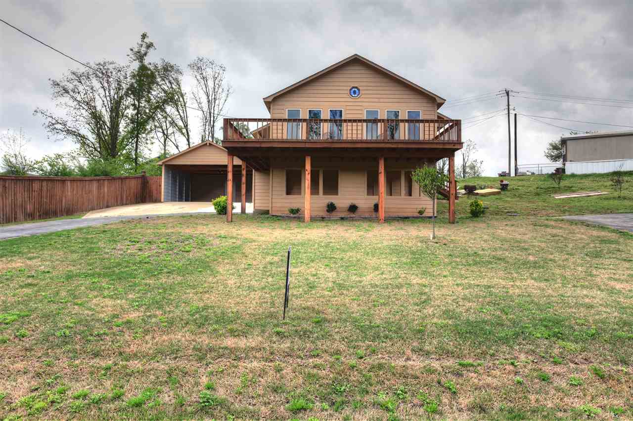 Fully renovated 2 bedroom, 2 bath home. Renovated from the ground up with a vaulted ceiling in the living area, wood flooring & granite counter tops in the kitchen with tile in all wet areas. Relaxing views of one of the premier fishing lakes in Arkansas from the kitchen, living room & large deck. This would be the perfect retirement/downsizing home or weekend getaway. Two car detached carport with additional storage.
