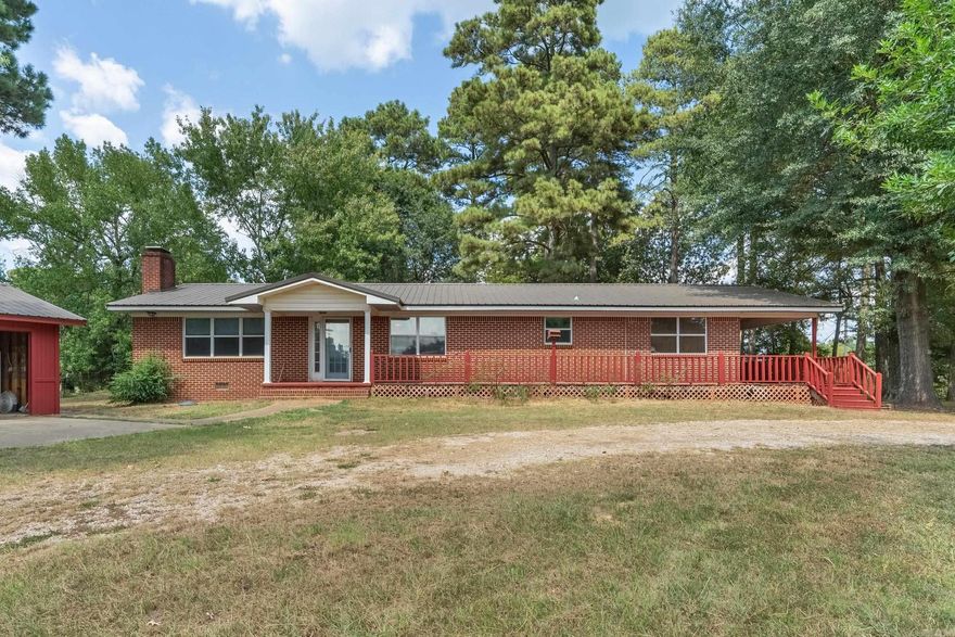 Built in 1967, with recent remodels this home has 3 bedrooms, 2 baths and walk-in closets. It is 1827 square feet and sits on a corner lot with almost 2 acres of land and a circle drive. The house is on rural water and has a well pump for the yard. It has a 2 car garage with an electric garage door and shop out back for more storage!