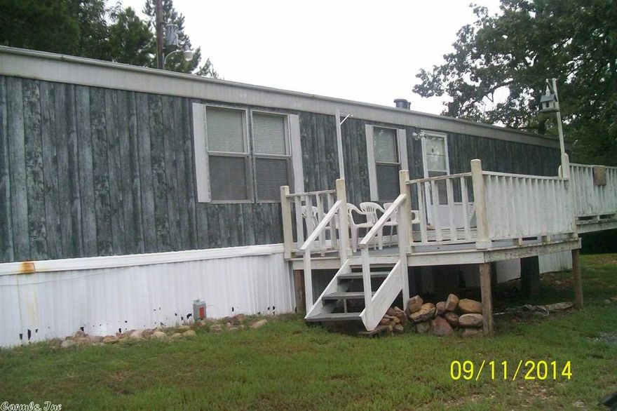 Well maintained mobile home with new carpets. Garden tub in master bath with lots of walk in closets.  2.7 acres with lots of woods, not far from Lake Wilhelmina and close to town. Great price!