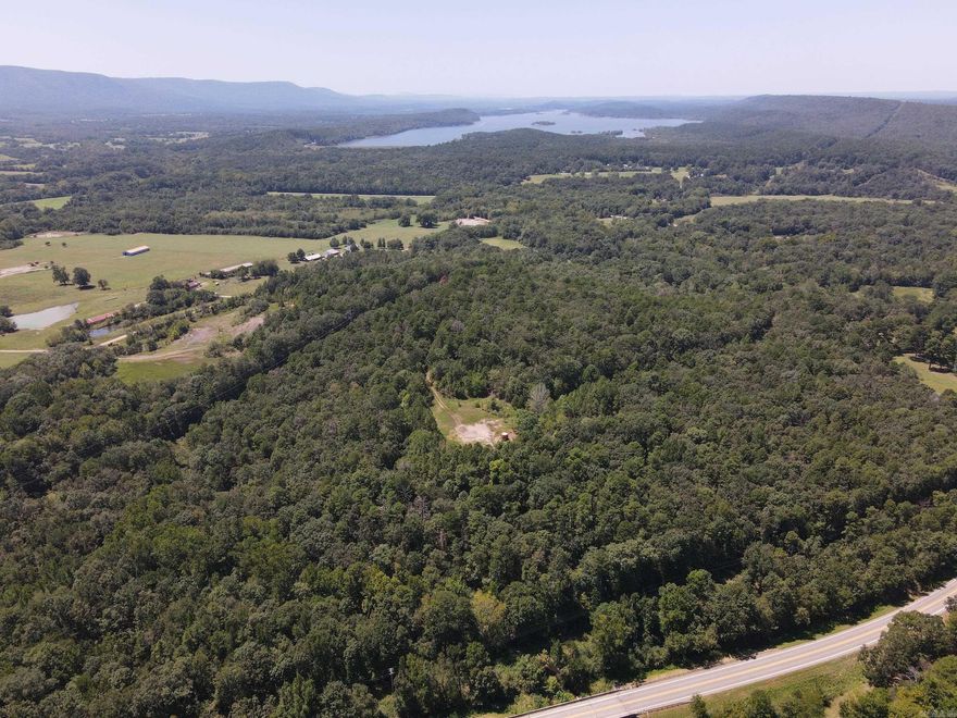The land features large mature timber and abundant wildlife, making it a haven for nature enthusiasts and hunters alike. Clear Creek flows along the property’s border, adding to its natural charm. With utilities available along the road and convenient access via Highway 10, this property offers both tranquility and accessibility.