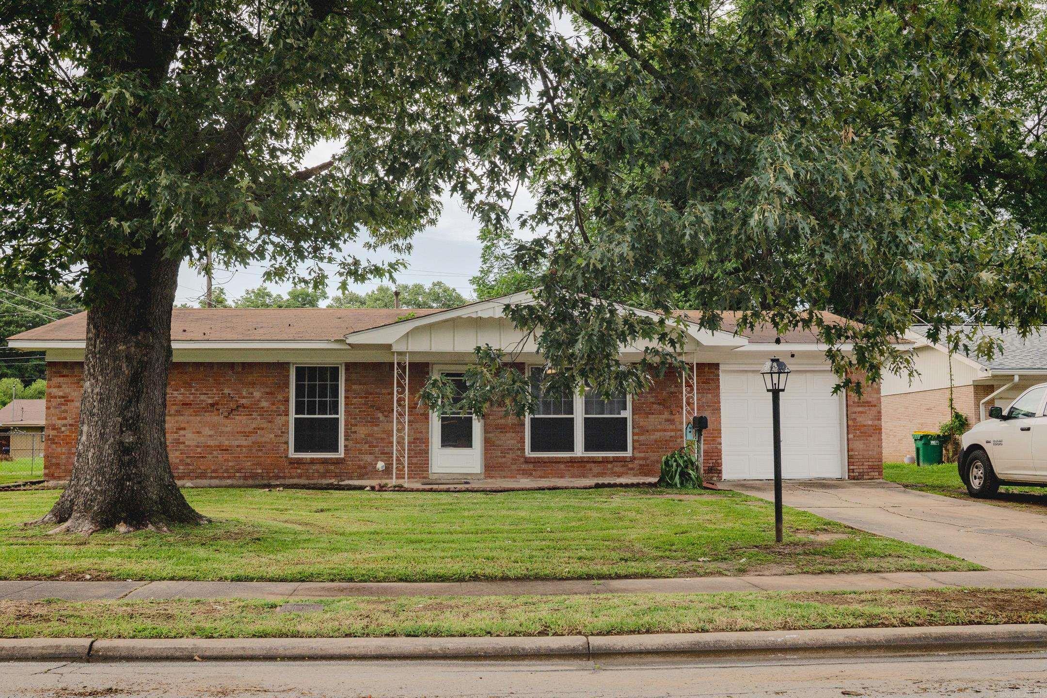 Adorable Home in Broadmoor Addition! Spacious single family home has 4 bedrooms, 1.5 bathrooms, and 2 living areas. Roof replaced in 2018. Hardwood and vinyl flooring, features a cozy wood-burning fireplace, central gas heating and cooling. One story level and fenced in backyard.