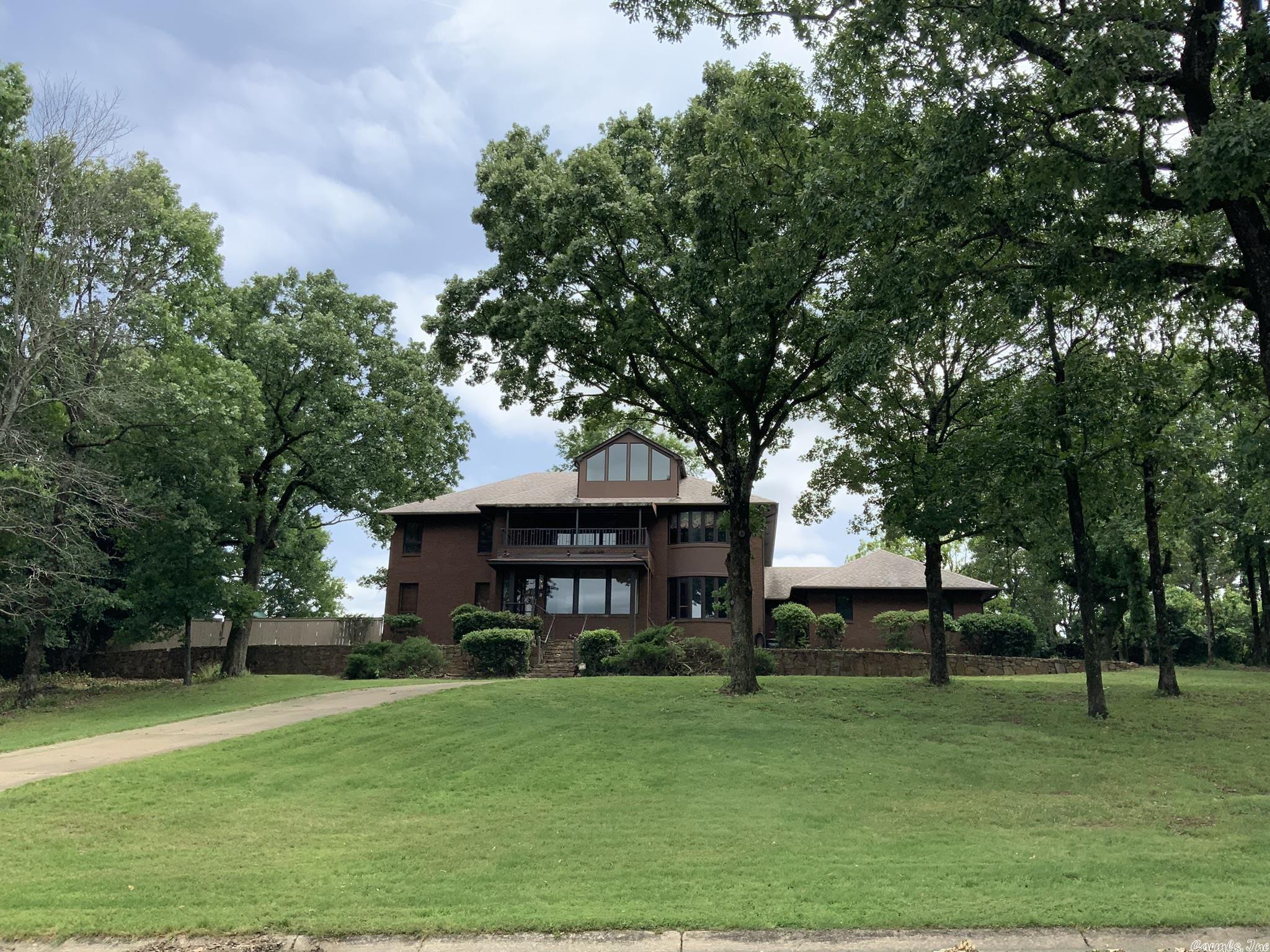 AMAZING LOCATION-RARE OPPORTUNITY! 5382 sf with spectacular views of the AR River. Great room W/19' ceiling, cypress wood & black marble wood burning FP.  Magnificent curved stairway, curved motif wall, master suit, formal din, laundry rm, 2 half baths ,Florida rm on main level.  2nd level 3 br's, den, study & sun porch, 3 baths.  Insulated garage & 864 sf wk shop.  2 AC units, 2 tankless HWH's & dehumidifier.  3 rd level - studio w/ river views.  IR reflective roof shingles SF approx. measuring encouraged.