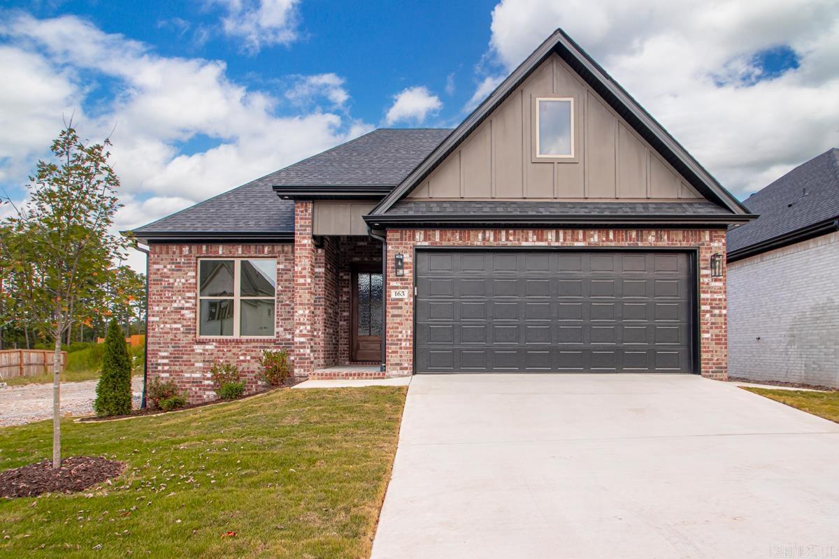 New Construction home in Fletcher Ridge - 3 bedroom, 2 bathroom, 2 car garage. Features custom cabinets, solid surface countertops, stainless appliances, gas cook-top, wall oven, built-in microwave, pantry closet, vented gas log fireplaces, tiled master shower with upgraded energy efficient packages that include foam insulation in the exterior walls. Agent owned.