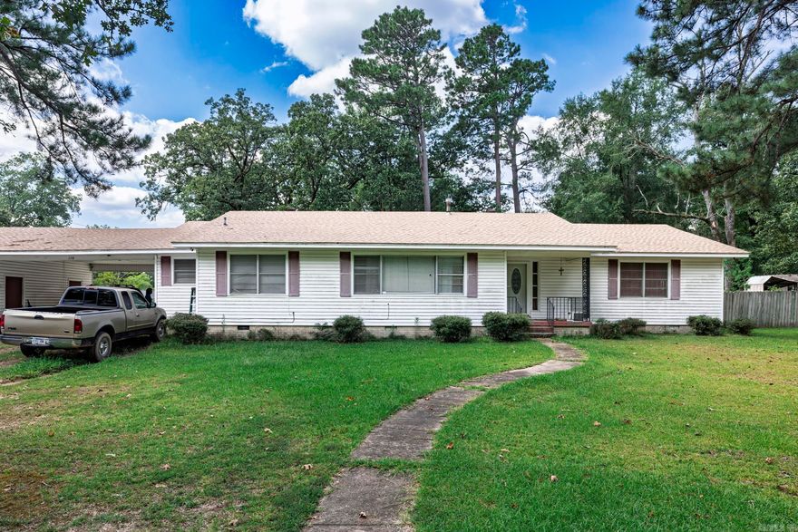This three-bedroom, two-bath home in Gurdon, Arkansas sits on an oversized lot and offers plenty of space both inside and out. The property features a spacious fenced-in backyard, perfect for outdoor activities, pets, or gardening. Inside, you’ll find multiple living areas including a comfortable living room, a cozy den, a formal dining room, and an eat-in kitchen, providing options for both everyday living and entertaining. With tons of potential for updates, this home is a wonderful opportunity to add your personal touch and make it your own.