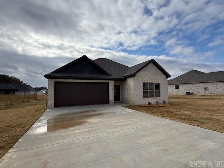 Large living room open to the kitchen. Pantry in the kitchen. Nice sized island in the kitchen with cabinetry in the island. Electric fireplace. Lots of windows make the home bright and airy. Guest rooms are separate from the primary bedroom. Tile showers in bathrooms.