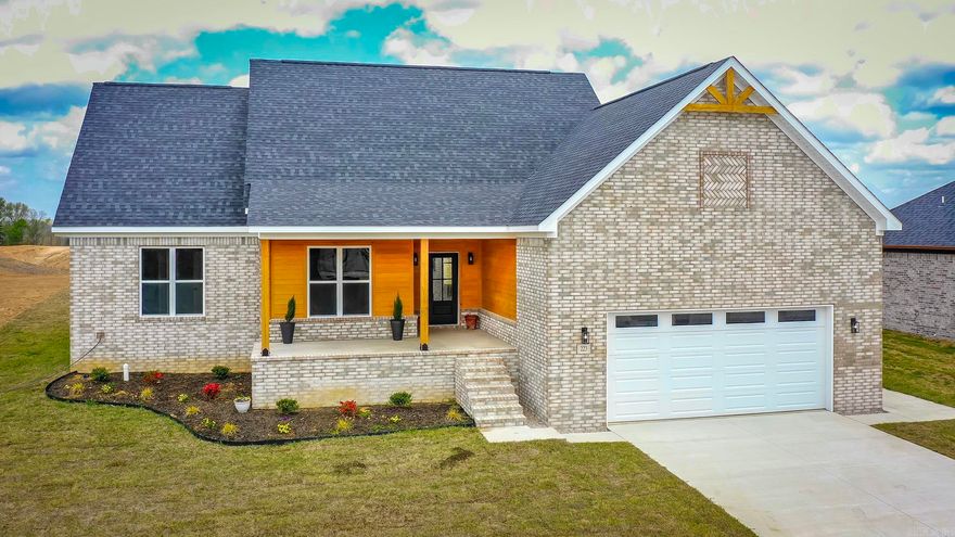 Welcome to one of Beebe’s newest neighborhoods, where modern design meets classic Craftsman charm! This beautiful new construction home features natural wood accents, stylish black fixtures, & durable luxury vinyl plank flooring throughout—offering both elegance & easy maintenance. Step inside to an open, split floor plan for comfortable living & effortless entertaining. The spacious living room showcases a vaulted ceiling & cozy fireplace, creating a warm & inviting focal point. The kitchen flows seamlessly into the living and dining areas, perfect for gatherings with family and friends. Enjoy peaceful outdoor living with large covered porches on both the front and back of the home, each featuring stunning wood plank ceilings that add to the home’s craftsman character. The fully sodded yard provides instant curb appeal and a ready-to-enjoy outdoor space. One of the most exciting features of this property is the future lake being developed just behind the home, making this a prime lakefront lot once completed—offering beautiful views and added value. This home perfectly blends timeless craftsman style with modern finishes, all in a growing community just minutes from everything.