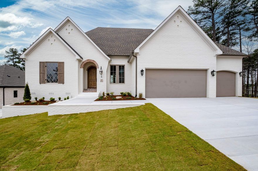 Gorgeous new construction with beautiful views. Two story open floor plan with 4 beds/4 full baths and 2 half baths. All bedrooms are ensuite with beautiful vista views. Gourmet kitchen with GE Monogram appliances. Double ovens, gas range, microwave and side by side freezer/fridge and huge honed quartzite island and countertops. Breakfast room, Dining room and open living room with stunning fireplace tiled to the ceiling. On main floor is primary bedroom and bath w/walk in shower, private water closet, double vanities, soaking tub and walk in closet with built in shelves and drawers. Also on main floor is ensuite guest room, office, half bath, laundry w/sink and walk in pantry w/wet bar. The living room has a wall of windows overlooking the covered patio w/fireplace and grill hook up. Downstairs is huge living room w/wet bar and fridge and dining area. Living space also looks over second covered patio with fireplace. Additional laundry room downstairs. Heated/cooled storage/flex room not included in sf. 3 car garage with storage closet and hot and cold water faucets. Sprinkler system. Floored attic. This stunning home built by Jackie Stevens is a dream!