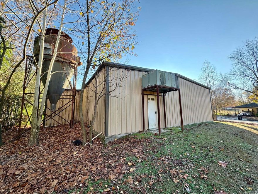 This spacious 2,000 SF metal shop offers incredible versatility — perfect for woodworking, automotive projects, storage, or creative workspaces. Includes two large garage doors, two exterior entry doors, and a private office area.