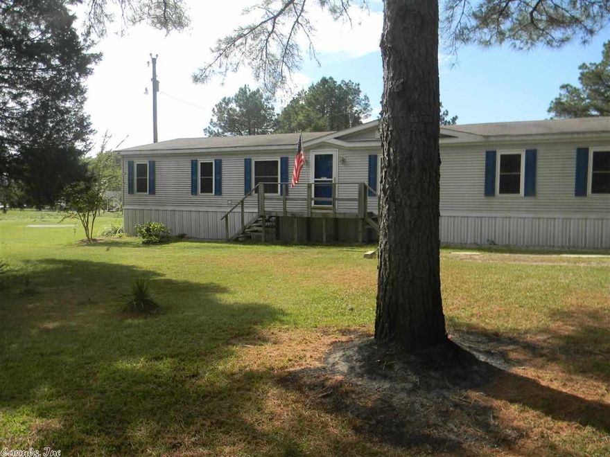 What a spacious, beautiful home on two acres in a country setting! A large open living area with wood burning fireplace opens up into a beautiful kitchen. The split floor plan offers a large master suite with jetted tub. Out back you will find a large yard and a shop with electricity!  Byrant schools!