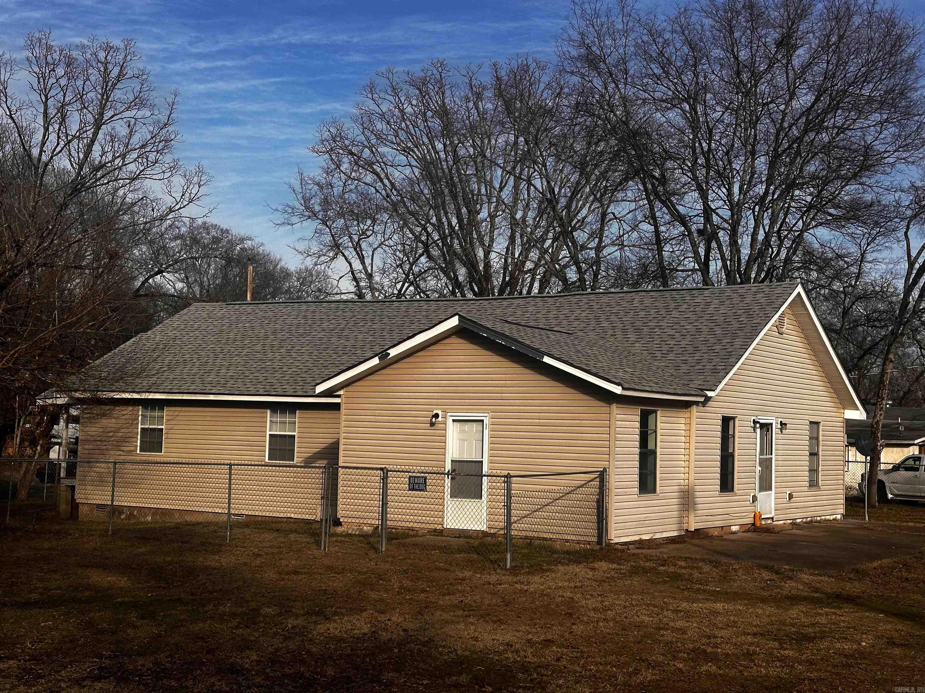 Located in a prime area, this 3 bedroom, 1 bath home offers a lot of potential. Situated on a large lot, it features a large yard with a versatile cinderblock building, complete with a walk-in freezer, a full bath and kitchen sink-perfect for a workshop, studio, guest quarters and/or storage. This property also offers a wood corral, idea for animals or additional storage. It is being offered "as-is", and is in need of further renovation allowing multiple development possibilities. Seller will consider any offer, owner financing, and possible trade for other properties.
