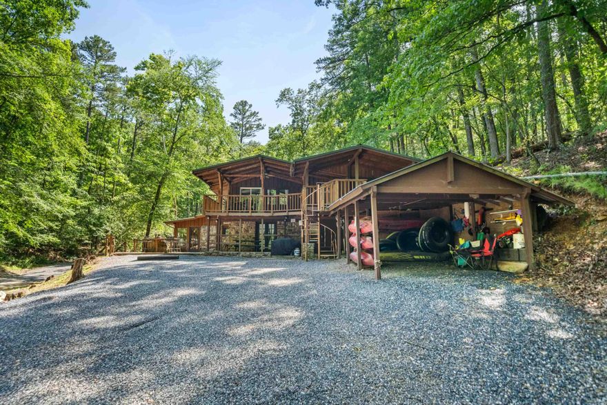 Lake Ouachita retreat with room for guests! This established and highly rated vacation rental property offers 8 bedrooms, 4 bathrooms, and sleeps up to 16. It’s ideal for getaways, rental income, or both. Adjoining U.S. Army Corps of Engineers land.  With a scenic creek flowing into the lake—perfect for relaxing, entertaining, or hosting guests. Recent updates include a full interior repaint, new bedding and towels, indoor and outdoor lighting, electrical and plumbing upgrades, a Blackstone grill, outdoor barbecue pit, fenced courtyard, gated entrance, and improved driveway and parking. The home also features multiple fireplaces, a full kitchen, Dish TV, and laundry facilities with dual washers and dryers. Rated 10 on VRBO with 128 reviews, this turnkey retreat is ready to enjoy or continue as a thriving rental.