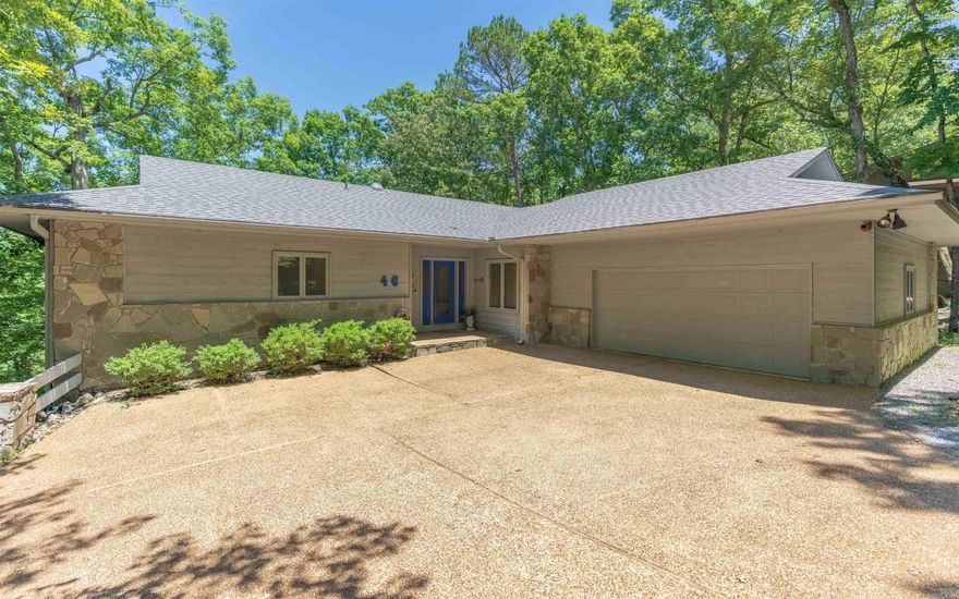 The views are amazing - look down on Cortez Golf Course and see mountains in the distance - so very pretty and peaceful.  This large and welcoming 4 bedroom home is a very successful nightly rental.  Open concept that's full of light on the main level with views from most every room.  Arkansas room takes it all in.  Wide open kitchen and dining area with bar to living room.  Huge primary bedroom with updated bath and huge closet, too.  One guest bedroom on the main level or it could be an office. Downstairs has another living room with kitchenette and beverage frig, two bedrooms and a bath. Large storeroom/owner's closet or safe room - whichever you need.  Many updates throughout the house including, new roof in 2021, upgraded HVAC with baffle system and two thermostat controls, wood and tile flooring throughout (no carpet), new decks on both levels.  Oversized two car garage.  Furnishings are negotiable to continue delighting visitors and generating more than $40,000/year in revenue.