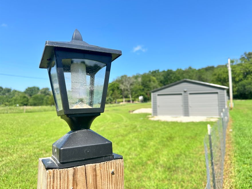 REDUCED PRICE! Spring River Retreat! Super Cute FURNISHED Tiny House with add on sleeps 7 in the main house and an additional "cabin" is powered and ready for your comfortable use!  There is a separated private bedroom, a loft and a bunk room. The full bath features a full size walk in shower, vanity, and washer/dryer!   You won't believe the amount of storage!  The one acre house site grants a secure, fenced perimeter with lighting, cameras and gates at both the front and back entrances. Near the back entrance is large 2 bay garage, insulated, powered, and on a nice slab foundation.  Plumbing and the beginning stages of set up for additional RV parking has been put into play. This SPRING RIVER AREA property truly embodies the peace and grounding experience that comes with the area. If you know, you know.  If you don't, come check it out!