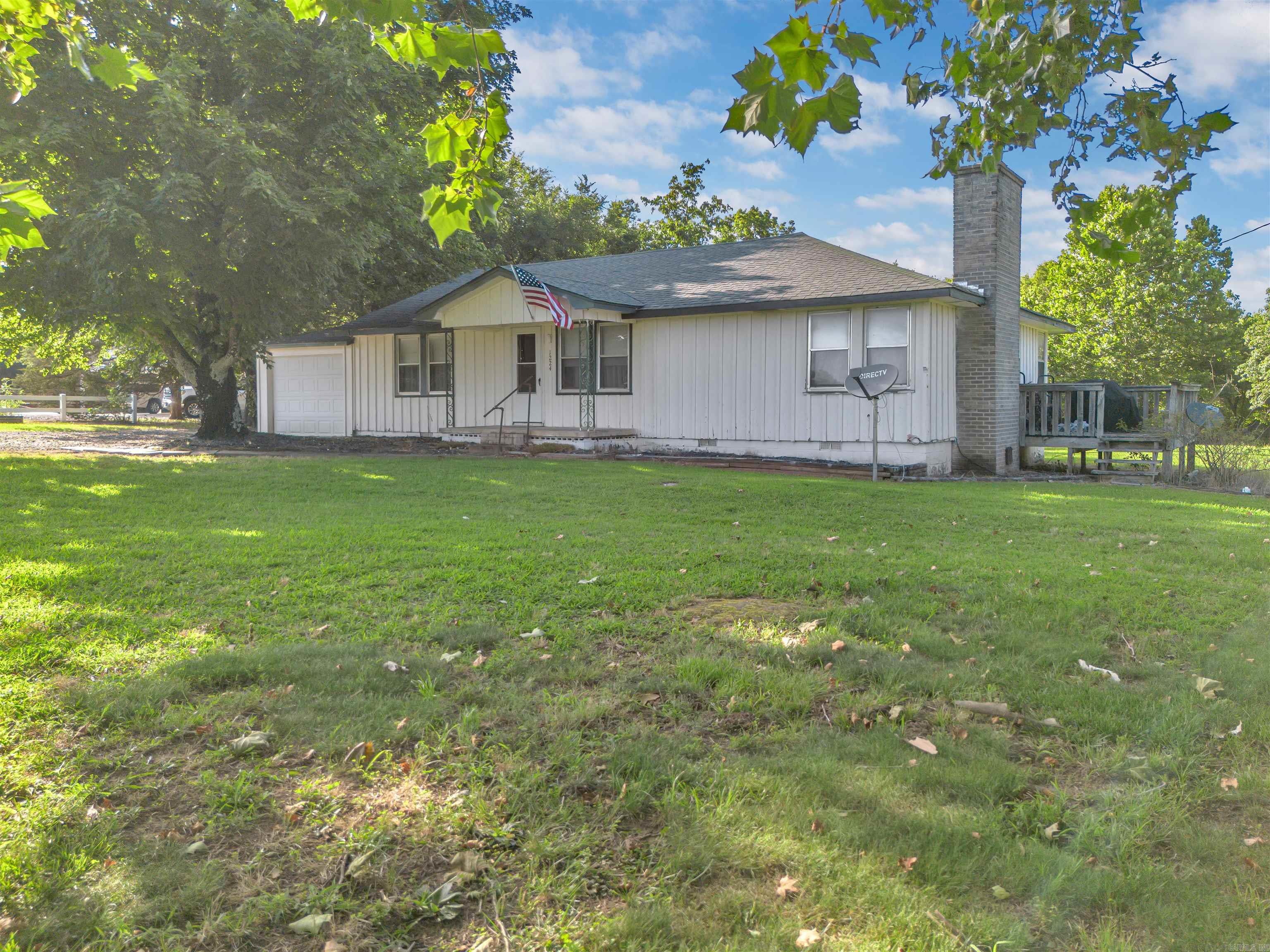 This well-maintained 2-bedroom 2 bath home sits on a scenic 2-acre lot atop Crow Mountain, offering peace, privacy, and potential. Perfect as a starter home or investment property, this all-electric residence features laminate flooring throughout and a cozy wood burning fireplace for year-round comfort. The kitchen comes equipped with well-kept appliances that convey. Enjoy a spacious backyard-ideal for gatherings, gardening, or simply relaxing under the open sky. If you're looking for your first home, a weekend retreat, or a smart investment, this property offers solid value in a beautiful setting. Property is being sold AS IS.