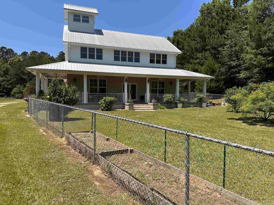 When you turn onto the private drive up to the house you will pass a beautiful 3 acre pond right before the beautifully custom built home appears in front of you. When you come onto the front porch you will enter the front door and walk into an open floor plan that is flooded with light from all the windows that give you great views. You will notice upon walking in the beautiful custom wood floors throughout the home.The great room is open to both the kitchen and dining area. It has a wonderful stone fireplace. The kitchen has granite counter tops, stainless appliances, custom cabinets with roll out shelves plus a view out the kitchen window.Off the great room is the master suite with his and her walk-in closets, an in suite bath with a huge walk-in shower, soaking tub, double vanity with quartz counters. Off the master is a beautiful sunroom to have morning coffee and just relax. Upstairs is a guest bed and bath plus a huge bonus room that could be another bedroom and living area.There is a room at the top that you can spot wildlife or see for miles. This home is on 39.5 acres with a 48x50 workshop and Mother in law guest house.this is a must see!