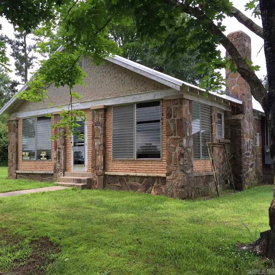 House had a new roof in 2013 and is in the dry.  Interior of house is just framework, no bedrooms or bathrooms exist at this time, but is laid out for 3 bedroom, 1.5 bath, could be 2 bath.  Very solid home. Electric & water on property. Acre is wooded, flat and there is a creek on back property line. Big beautiful trees on property.  Backs up to Deltic Timber land.   Cash or construction loan only. To be sold as is, whereis, no warranties or repairs.