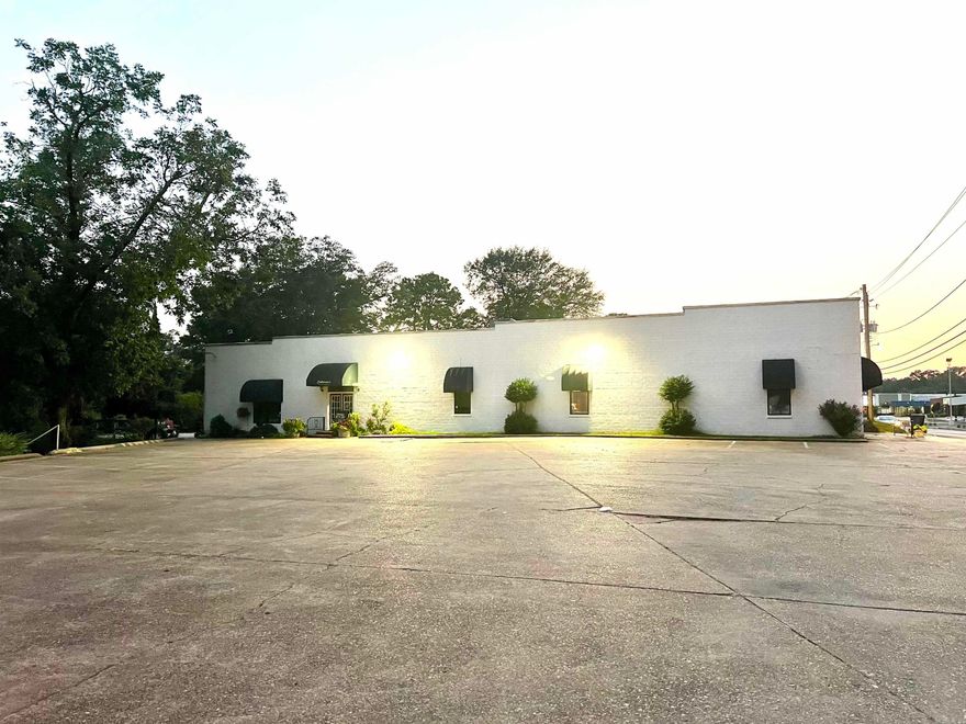 Prime -Visible - Commercial Location with Sound Building, Land and Great Parking!!!  Solid Block Building offering 5,500 square feet to use in numerous commercial ways It has formerly housed: meat processing plant, pharmacy, offices, retail, and most recently a restaurant.  It boast a functioning kitchen if you would like to purchase that equipment; seller's are prepared to sale it for additional price.  An amazing outdoor patio space to utilize, a rare feature in Camden's Commercial Properties.  2 Separate Bathrooms will allow for division of the building to make separate rentable spaces.  There are so many possibilities with this property on 0.55 acres of land.  *Selling building and land; not the business of Catherine's Bistro  *Will sell kitchen and restaurant equipment for additional price $