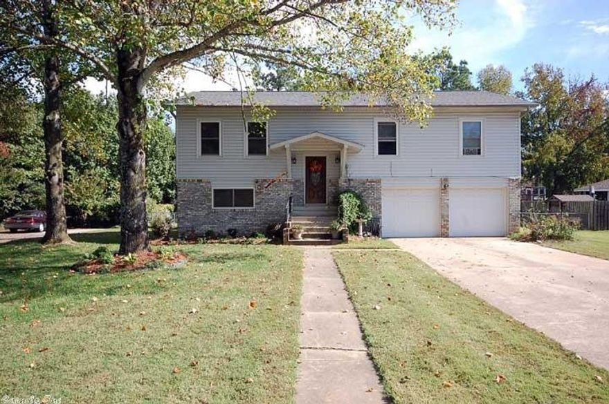 This darling home has so much space for the price.  Interior features split-level floor plan with 4 bedrooms and 2.5 bath.  Upstairs you will find large living room with corner brick fireplace, kitchen, 3 bedrooms and 2 bath.  Downstairs you will find a large second living/bonus room, a large bedroom and half bath.  Large fully fenced backyard with large upper deck and patio below.  Updated siding and windows and NEW A/C!