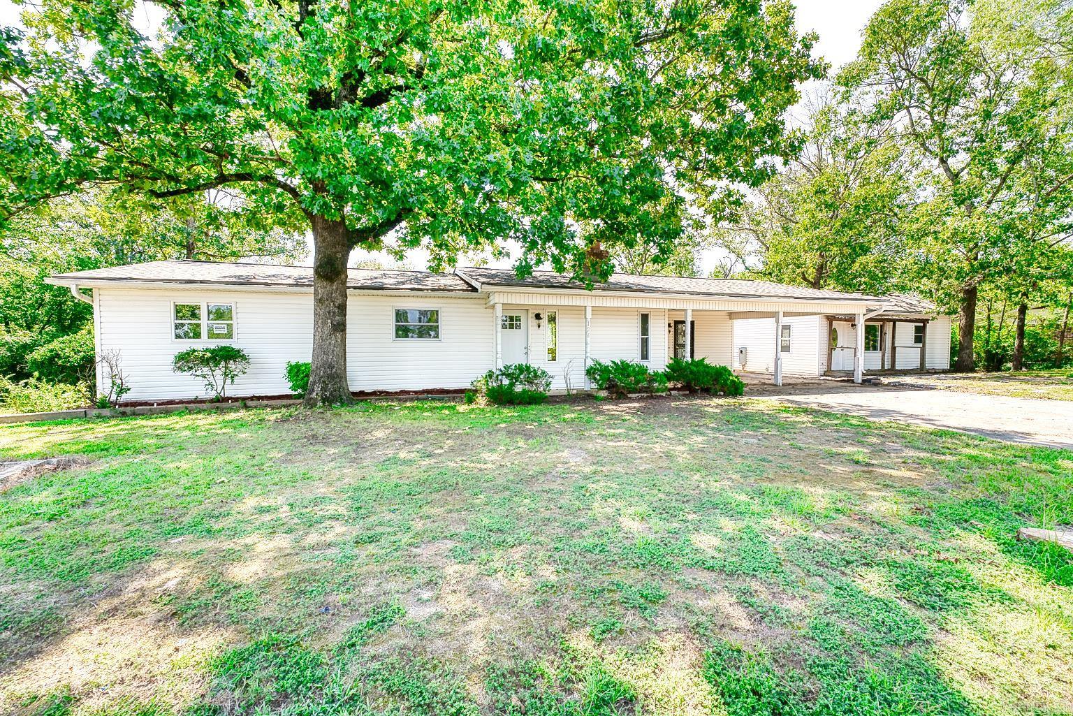 Nestled on one-point-seven acres in scenic Hot Springs, Arkansas, this beautifully remodeled property features a spacious three-bedroom, two-bath main home with modern finishes and freshly landscaped grounds. Sunlit interiors complement an open floor plan, perfect for entertaining or relaxing in style. The second home is a cozy one-bedroom, one-bath guest cottage complete with its own kitchenāideal for extended family, guests, or rental income. Outdoor spaces offer ample room for gardening, recreation, or future expansion. Experience peaceful country living with stylish updates and versatile accommodations, all minutes from Hot Springs attractions.
