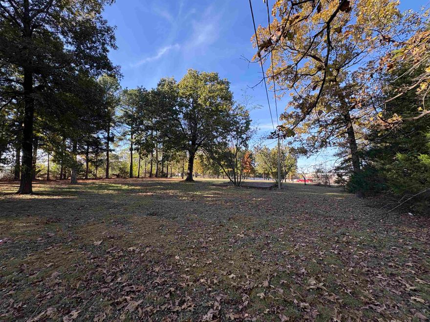 Prime Commercial Opportunity in Highland, Arkansas! Two adjoining commercial lots offering 2.0+/-acres exceptional visibility and access in one of Highland’s most sought-after business corridors. Located directly across from A.L. Hutson Memorial Center and next to the popular Highland Travel Center (Red Mule Gas Station), this 2-acre tract sits in a high-traffic area near White River Medical Center ER and the south entrance to Cherokee Village. With 200 feet of Highway 62/412 frontage and depth extending 400–500 feet to Rebel Heights Drive, you’ll have dual road access—perfect for customer flow and deliveries. One lot is cleared and ready to build, while the second remains wooded for flexible development. Includes a 24x24 utility building and a 22x30 metal-roof carport. City water and sewer available. This location is surrounded by thriving local businesses—ideal for retail, professional offices, or service ventures looking to grow in the heart of Sharp County.