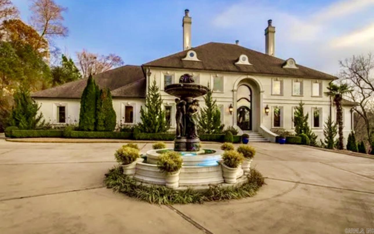 Live Like Royalty on the Lake! Welcome to Arkansas’ Ultimate Lakefront Masterpiece — a show-stopping, custom-built estate on 5.5 private acres with every luxury imaginable. From the gated entrance to 2 private boat docks, pool with waterfall & grotto, and an outdoor kitchen made for entertaining, this 4-story architectural dream will leave you breathless. Inside, it's an entertainer’s paradise with a home theater, indoor basketball court, arcade, sauna, safe room, wine cellar, and elevator connecting 5 stately ensuite bedrooms (6 full baths + 2 half baths!). Did we mention the tanning room, massage room, private gym, and chef’s kitchen loaded with high-end appliances? This is more than a home—it’s a private resort. Your dream life is waiting. Showings by appointment only—don’t miss your chance to own this one-of-a-kind treasure.