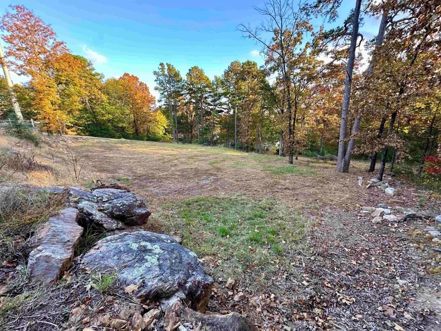 This property is located within walking distance to Greers Ferry Lake access & Peggy Sue's Restaurant. Excellent location for multifamily dwellings or commercial use. Survey available for review in documents.  The 150 x 150 parcel with frontage on Ash Street. There is a 20' wide alley on the north side of the property and Walnut St platted on the south side of the property that is currently undeveloped.