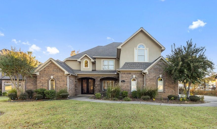 Discover luxury lakeside living in this exquisite home in Hurricane Lake Estates. Set on a .89 acre lot with 118ft lake frontage, this property features a new boat dock, gunite pool, and covered pavilion. The home welcomes you with a grand foyer, formal living room with two-story ceilings, and a spacious office. The gourmet kitchen, with 20 ft ceilings and an electric range, opens to a cozy hearth room with a fireplace. The oversized primary suite includes a private sitting area, gas fireplace, and a spacious bathroom. Upstairs, find 3 additional bedrooms, 2 bathrooms, and a unique catwalk leading to a tranquil nest overlooking the lake. With a 3-car garage, proximity to Bryant Schools, and local amenities, this home is a rare find.