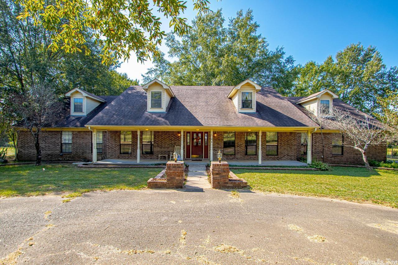 Country Living in Town! Beautiful home on 30 acres with 2 ponds and dock. Perfect for family or farming! Home features 5 Bedroom and 4 bath with 3 being master suites. Large bonus room with wet bar connections , detached barn/shop with Kitchen and bath, walk in refrigerator, freezer and commercial stove. Kitchen was previously used for catering purposes. Long paved driveway with parking for RV. City has approved water lines for this property to tie into.