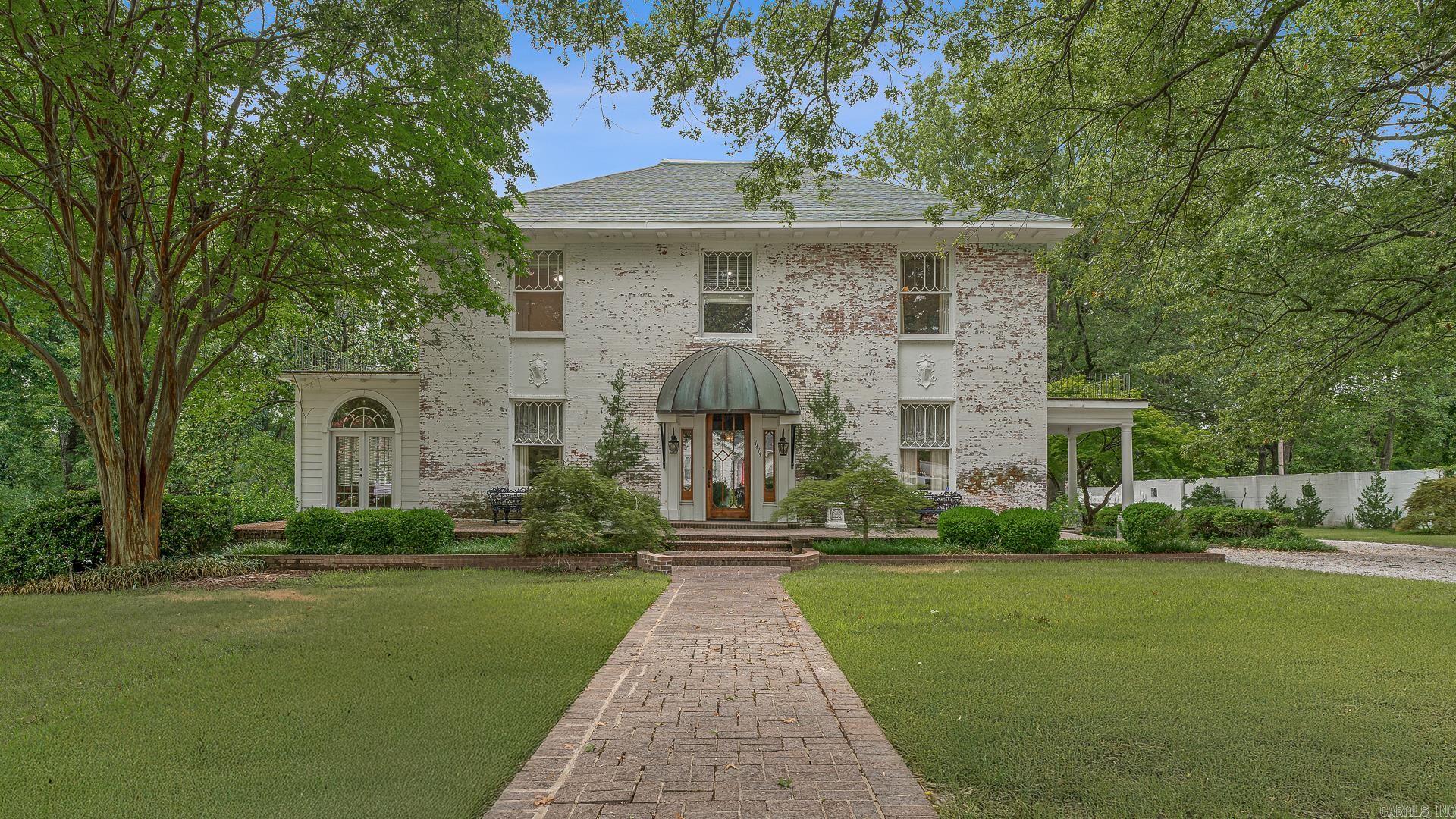 Step into timeless elegance with this historic 1903 residence, gracefully situated on 1.22 acres along prestigious South Main Street. Enclosed by a classic white stone wall, the estate welcomes you with terraced grounds, a sweeping circular drive, and a three-car garage with private workroom. Outdoor amenities abound, including an in-ground pool flanked by two pool houses, a raised garden, custom jungle gym, and a putting green tucked beneath the shade of two magnificent magnolia trees. Inside, the 4,520 sq. ft. home embodies old-world craftsmanship with grandly scaled rooms, soaring ceilings, and exquisite detailsāfrom a walnut-trimmed den to a light-filled sunroom and screened porch. The chefās kitchen is a true showpiece, featuring a Thermador 6-burner gas cooktop, double oven, striking onyx backsplash, and a generous walk-in pantry. Upstairs, the master suite and three additional bedrooms offer spacious closets and a thoughtfully appointed second bath. The 896 sq. ft. basement, complete with a full bath, provides versatile space for recreation, storage, or storm safety. Rarely does an opportunity arise to own such a distinguished piece of local history!