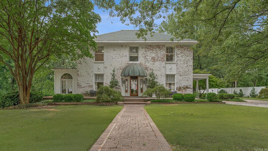 Step into timeless elegance with this historic 1903 residence, gracefully situated on 1.22 acres along prestigious South Main Street. Enclosed by a classic white stone wall, the estate welcomes you with terraced grounds, a sweeping circular drive, and a three-car garage with private workroom. Outdoor amenities abound, including an in-ground pool flanked by two pool houses, a raised garden, custom jungle gym, and a putting green tucked beneath the shade of two magnificent magnolia trees. Inside, the 4,520 sq. ft. home embodies old-world craftsmanship with grandly scaled rooms, soaring ceilings, and exquisite details—from a walnut-trimmed den to a light-filled sunroom and screened porch. The chef’s kitchen is a true showpiece, featuring a Thermador 6-burner gas cooktop, double oven, striking onyx backsplash, and a generous walk-in pantry. Upstairs, the master suite and three additional bedrooms offer spacious closets and a thoughtfully appointed second bath. The 896 sq. ft. basement, complete with a full bath, provides versatile space for recreation, storage, or storm safety. Rarely does an opportunity arise to own such a distinguished piece of local history!