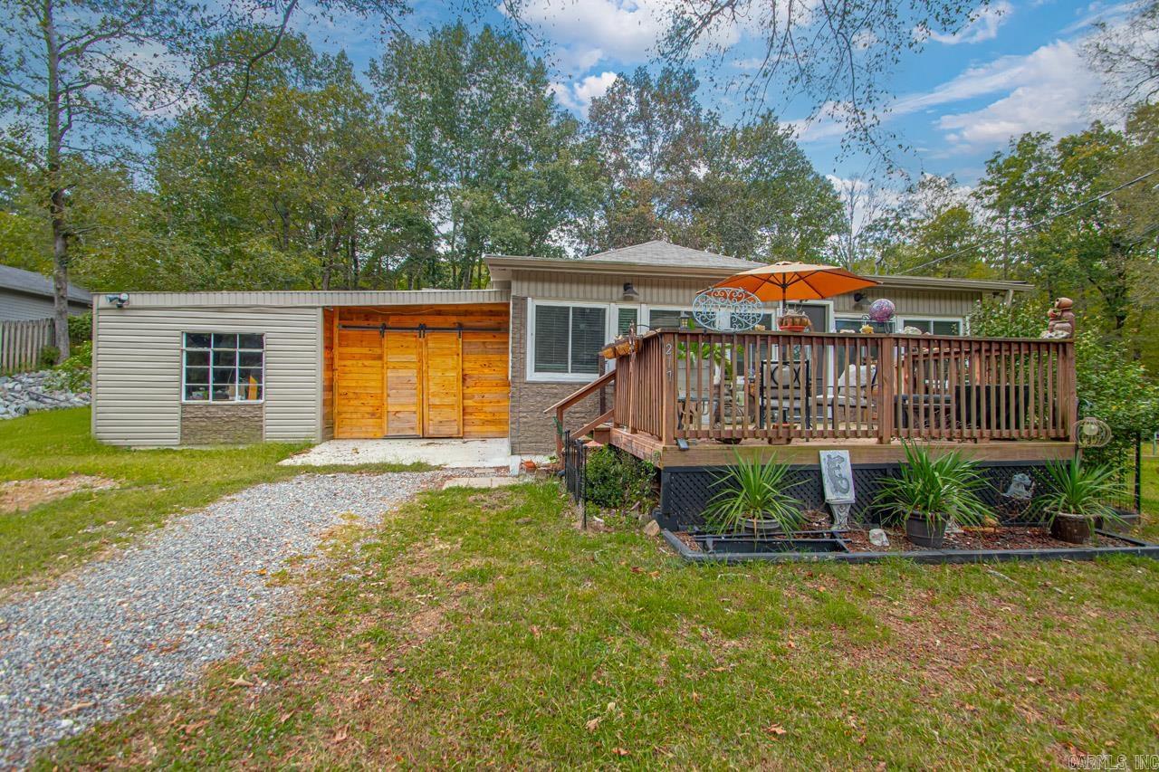 Take a look at this beautiful country home sitting on just over 3 peaceful acres!! This home has charm for days and appears to have the original hardwood flooring throughout most of the home. This home features a very spacious and open floor plan with large bedrooms, tons of storage and a huge sunroom with energy efficient windows. Outside you will find a area that is set up for RVs with electric, water and septic complete with a new pump (could be additional income). Outside features a stand alone well and a large fenced area that is perfect for pets and livestock plus has tons of hickory trees throughout. The carport has recently been enclosed and has several upgrades such as 220 wiring to the outside corner, new lighting, and new concrete floor installed making a very spacious workshop and storage area! If you are tired of the subdivision life and looking to enjoy nature, wildlife and even start getting into the homesteading lifestyle than this property might just be the perfect fit for you! Call me or your local agent today to get more information and to schedule a private tour of this beautiful property.