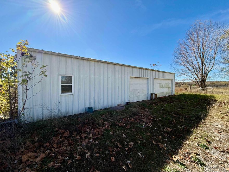 This 2.41-acre property is in a prime location just minutes from town and the airport. Featuring a 1,500 sq. ft. insulated steel frame shop with two garage bay doors, concrete floor, and electricity. Private well and septic system already in place. The land is level, with beautiful country views!   A 1624 sq. ft. double-wide manufactured home on the property has significant mold damage and will need to be gutted, treated or removed. Whether you’re looking to build, develop, or use the shop, this unrestricted land gives you the freedom to create your ideal space. Great opportunity for country living with easy access to town!   Great opportunity for country living with easy access to town!