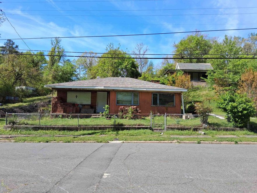 Investment property which means AS-IS. Some rehab work has been done. All building materials will be left to help new owner with rehab. Seller is only responsible for his tools that are in the garage. Minutes from downtown, hiking trails and stores. If purchased with property 421 Holly St. total list price is 150k. 421 Holley St. is listed for 80K