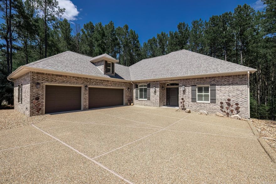 Want new but don't want to build it? Now is your opportunity to walk in to this stunning home that has been meticulously cared for! This all brick home welcomes you from the moment you walk in the door. Crown molding throughout with volume ceilings and lots of natural light. Enjoy entertaining in the open plan with a large island in the kitchen open to the dining area and great room. Beautiful study with built in cabinetry. Spacious primary bedroom and bath with walk in shower and large walk in closet. Two additional guest bedrooms in the divided bedroom plan. Guest bath is convenient to the guest bedrooms. Separate laundry room with an abundant amount of cabinetry for all your needs. Side load three car garage with floored attic storage above. Step out back to the covered deck and enjoy the tranquil setting with common property behind giving you the seclusion you desire yet you are close to the East end amenities. This one is truly move in ready! AGENT REMARKS.