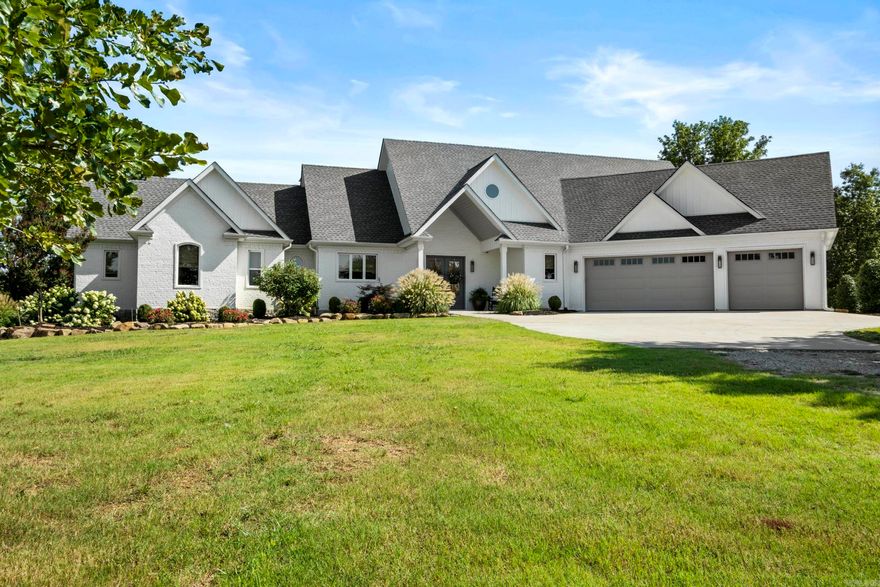 Custom built home w/premium amenities throughout.  Open floor plan provides easy flow from kitchen / dining to the living area which offers a cozy gas fireplace flanked by built ins. Office area off the living room. Half bath main level. Gourmet kitchen features quartz countertops, double ovens, six top gas burner stove, farmhouse sink, undercounter microwave & the island is a chef's dream.  Living area has lots of windows & 3 sets of French doors leading to the outdoor entertaining area complete with views of the pond.  Surround sound system from inside the home and out to the large covered patio.  Primary suite features a walk in closet w/built ins including a vanity area.  Oversized walk in shower in primary suite plus soaking tub complete this deluxe suite.  Safe room located on main level in the guest room which has ensuite bath. Sprinkler system. The shop is an outdoor enthusiast's dream with Over 3900 sq ft. Roll up doors on each end.  W/D hookup.  Half bath.  Cedar closet.  Lofts w/stairs on each side.  Two storage rooms (could be office). Lean to on each side.  RV hookup outside shop.  20 acres is apprx 1/4 timber covered.