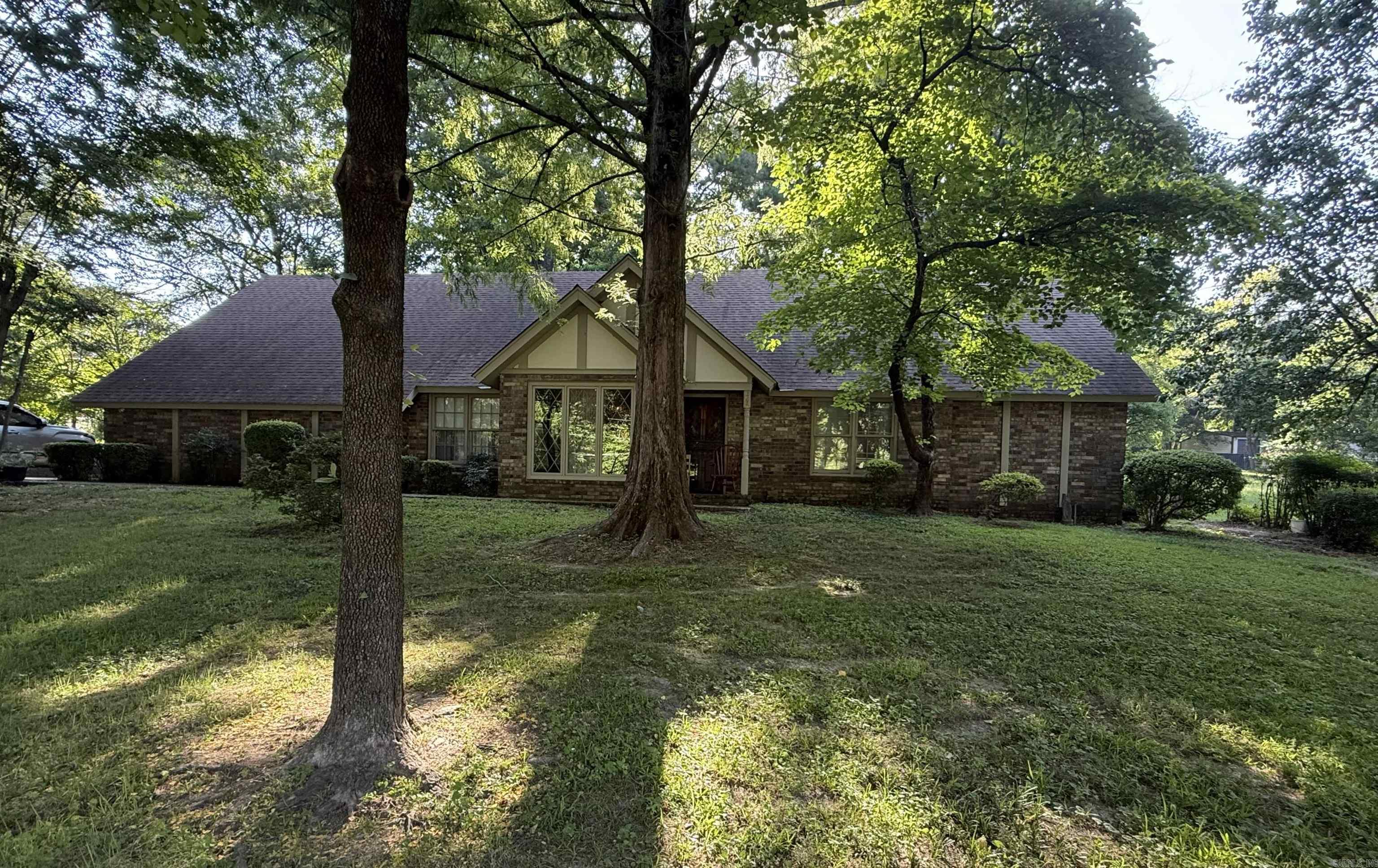 Do not disturb the tenants. This lovely home nestled on a shaded lot on N. Forrest St. has 3 bedrooms, 2 bathrooms, large kitchen/breakfast room, huge living room/dining room combination with a gas burning fireplace, game room with office space, abundant storage, screened gazebo. Retaining walls were added to the property which has mature trees and nice landscaping.