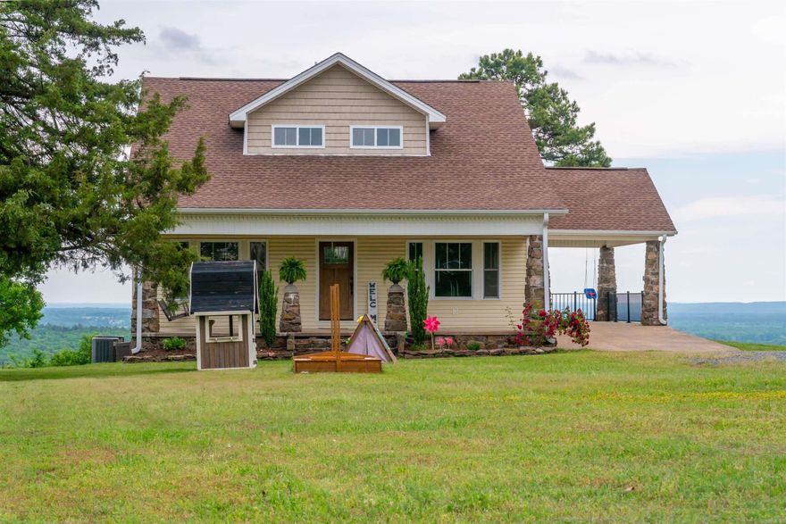 Take a look at this beautiful Craftsman-style home nestled amongst a very private 20 acres (some pasture, but more woods) with absolutely gorgeous views off the back of the home! There is no price tag to put on this stunning view! You could watch the sunrise every morning on the deck or watch from inside the huge family/sun room covered in windows on three sides! This home features a great open floorplan, two living areas, formal dining room between the kitchen and front living area, spacious kitchen with a lot of counter space and cabinetry, double oven, wood floors throughout, storm room under home & a spacious laundry room. The primary bedroom is on the main level as is another bedroom that could be used as an office with a full bath right outside. Go upstairs and you'll find a large bonus room, two bedrooms and two full baths! The crawlspace has been totally encapsulated & can be used for more storage! Agents see remarks