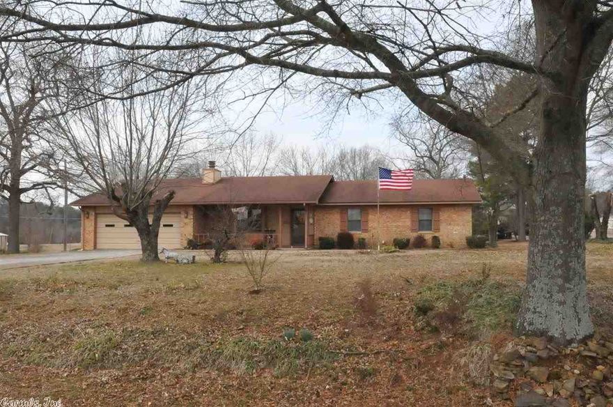 Roomy 3BR/2BA home.  Kitchen is spacious with island and open to Living area.  HUGE workroom off kitchen.  Bedrooms are large with walk-in closets.  1 acre yard. New AC in 2011, WH Brand new.  Lots of flowers in yard.