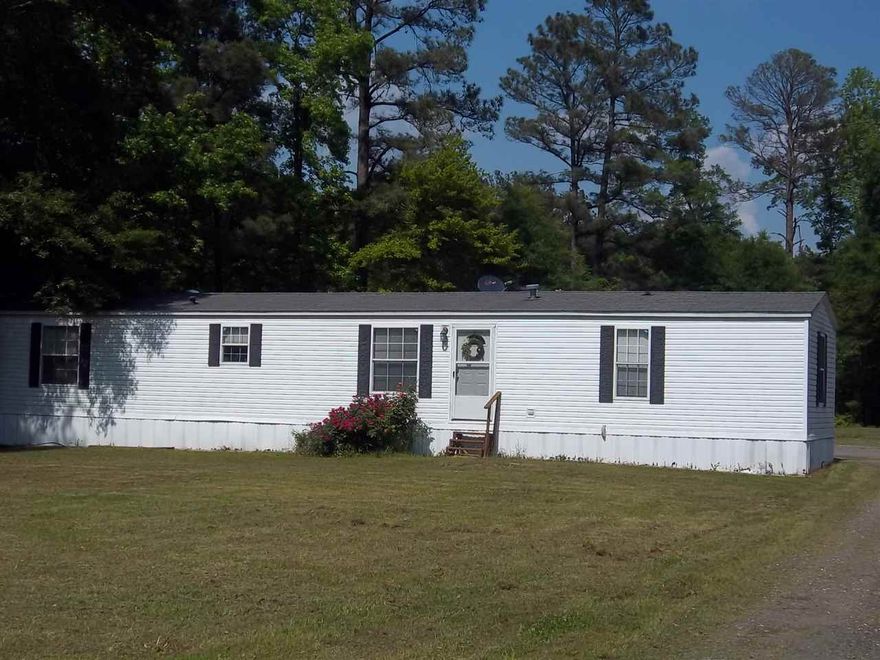 VERY nice/clean updated mobile home for first time buyer or rental for investors.  New wood vinyl flooring, large garden tub in master with separate walk-in shower & walk-in closet.  Oak cabinets, double-paned windows, Propane fireplace (otherwise all else in home is elec).  Fridge remains with property.  Large pantry closet.  Nice updated appliances.  MOVE-IN READY.  All offers considered.  CASH or CONVENTIONAL LOAN.  Taxes are -0- with H/S Credit.