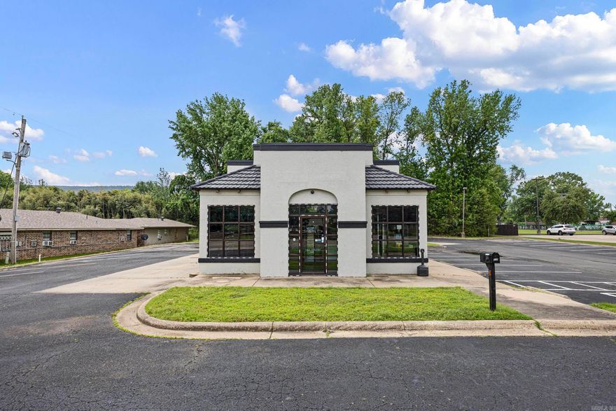 Prime commercial opportunity in a high-traffic, central location. This recently renovated 1,604 sq ft building offers excellent visibility and versatility, formerly operating as a smoke shop and previously a restaurant—making it well-suited for a variety of business uses. Positioned in the heart of town, the property is within walking distance to the high school and directly across from the hospital, providing consistent foot and vehicle traffic. Features include existing walk-in refrigerators, a drive-thru window, a bathroom, dedicated office space, and a spacious paved lot with ample parking. Ideal setup for restaurant, retail, or service-based business with strong potential for redevelopment or continued commercial use.