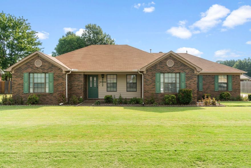 Meticulously Maintained with an Excellent Floor Plan! This 3-bedroom, 2-bath home on Killough Road is a true gem, offering comfort, convenience, and thoughtful design. Ideally located near shopping, schools, and everyday amenities, it provides easy access to just about anywhere. Inside, the spacious layout invites you in with a warm family room anchored by a brick gas-log fireplace—perfect for cozy evenings. A formal dining room sets the stage for gatherings, while the bright eat-in kitchen with ample cabinetry makes cooking and entertaining a joy. The expansive primary suite is designed as a retreat, featuring a separate tub and shower, double vanities, and a generous walk-in closet. A desirable split floor plan ensures privacy, with two additional bedrooms and a full guest bath tucked away for family or guests. Outdoors, this home shines with excellent curb appeal, landscaping, and lush grass. A hidden side-entry garage enhances street appeal and privacy, while the detached garage/workshop offers versatile space for storage, hobbies, or projects. Perfect for hosting friends, raising a family, or simply enjoying peaceful evenings at home, this move-in ready property is a must see.